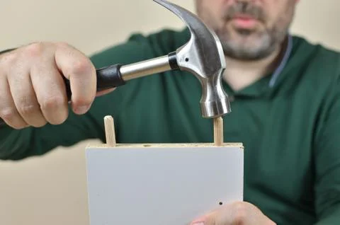 Man Inserting Dowels Stock Photos