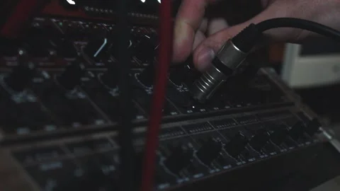 Man inserting a jack cable Stock Footage 142810785