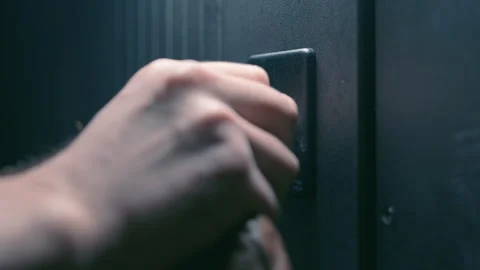 Man Inserting Key into Modern Front Door Lock | Close-Up Hand Unlocking Door Stock Footage 345762063