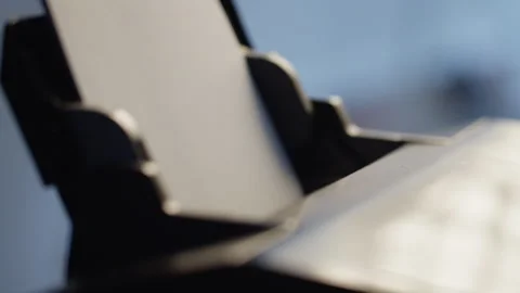 A man is inserting pieces of paper into the printer Video stock 271547881