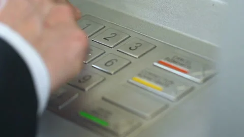 Man inserting pin code, making mistake and pressing correction button on ATM Stock Footage 92603530
