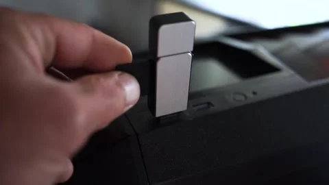 Man inserting an SD card in card reader Stock Footage 310884592