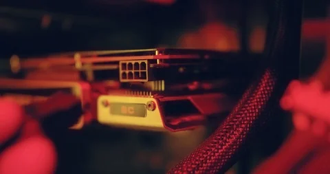 A man inserts an ATX PCI-E PCIe 8 Pin power connector and launches a video card Stock Footage 125838042
