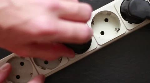 Man inserts a cable into the socket Stock Footage 64622324