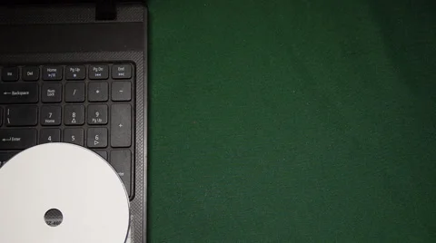 Man inserts DVD on laptop computer Stock Footage 53206033