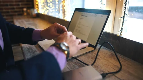 The man inserts the hard drive into the laptop Video stock 85899309