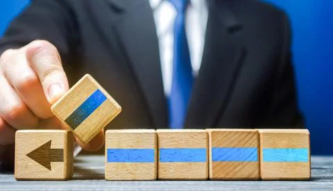 Man inserts the missing part to continue the progress of the work. Implementa Stock Photos