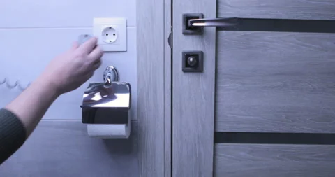 Man Inserts Plug Into Electrical Socket Stock Footage 126913216