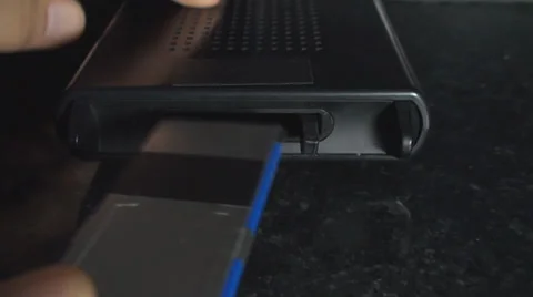 Man Inserts SXS Type Card Into A Card Reader Close Up-Shot Stock-Footage 36035002