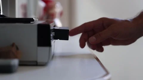 A man inserts a VHS cassette into a video player. Stock Footage 255237873