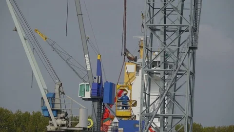 A man inside a box being carried by the crane Stock Footage 79090495