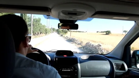 Man inside a car Stockbeeldmateriaal 101591843