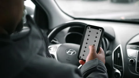 Man Inside Car Looking At Phone Stock Footage 166522845
