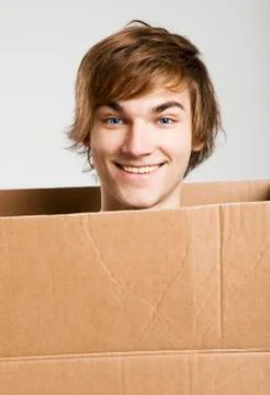 Man inside a card box Stock Photos