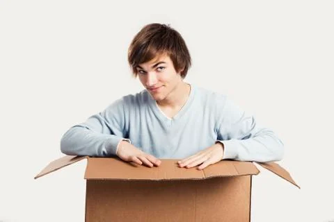 Man inside a card box Stock Photos