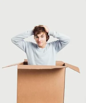 Man inside a card box Stock Photos