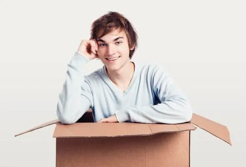 Man inside a card box Stock Photos