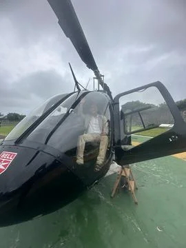 Man inside the helicopter Stock Photos