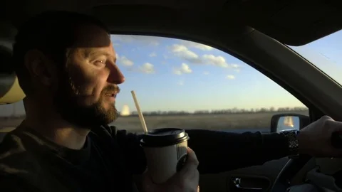 Man inside his car, driving on a summer day Stock Footage 73440010
