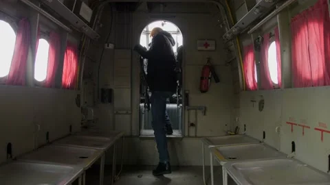 A man inside an old An-2 airplane. Walks along the fuselage. Stock Footage 200786262