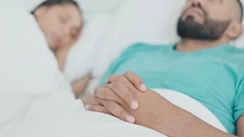 Man, insomnia and thinking in bed, couple and stress with memory, ideas and Stock Footage 248412117