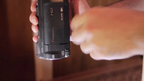Man inspecting a video camera Stock Footage 90814384