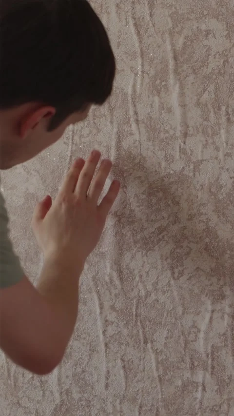 Man inspecting water damage on swollen apartment walls Stock Footage 338003356