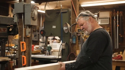 Man inspecting wood board in workshop Stock Footage 102044966