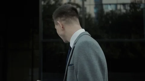 A man inspects the building and makes notes Stock Footage 113471308