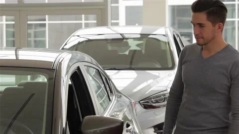 A man inspects interior of the vehicle Stock Footage 252681614