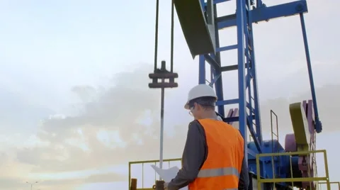 A Man Inspects Oil Rig Stock Footage 68941684