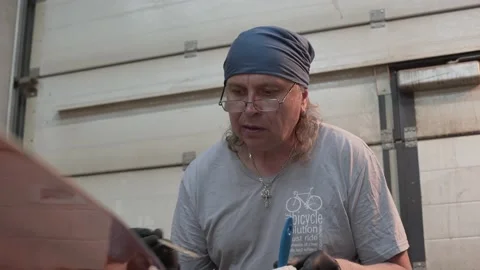 Man inspects the surface of the Surf Board Video stock 132168434