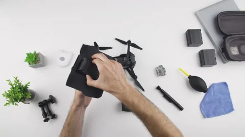 Man install a battery on drone DJI MAVIC AIR Stock Footage 138060205