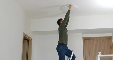 Man install modern led light into ceiling hole Stock Footage 102248510