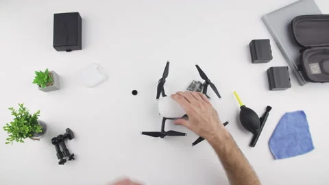 Man install ND neutral density filter on drone DJI MAVIC AIR Stock Footage 138059245