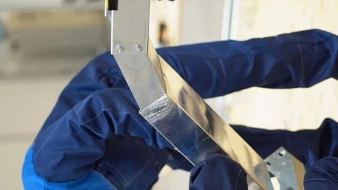 Man install tin chute made of several composite prefabricated parts on bolts Video stock 126358205