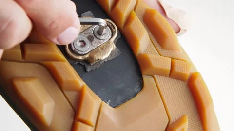 Man Installing clipless pedal to the cycling shoes. Stock Footage 132583307