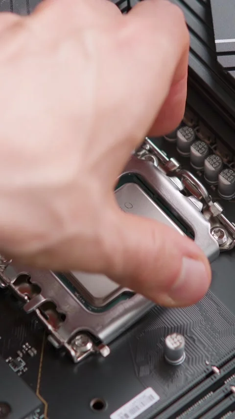 Man installing a CPU on a motherboard. Computer hardware. Close up Stock Footage 310299450