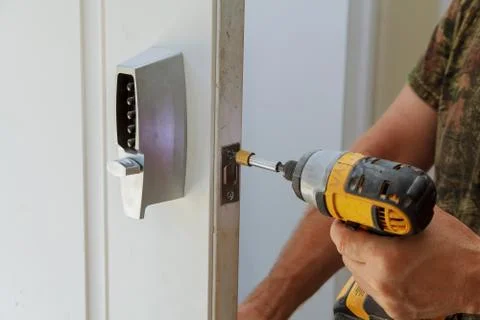 Man installing of the door lock security 스톡 사진