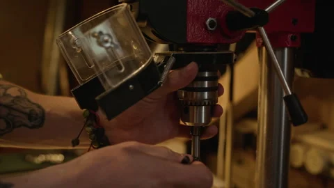 Man Installing Drill Bit in Drill Press Machine in Workshop Stock Footage 340402824