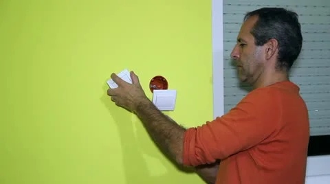 Man Installing an Electrical Switch Stock Footage 22003063