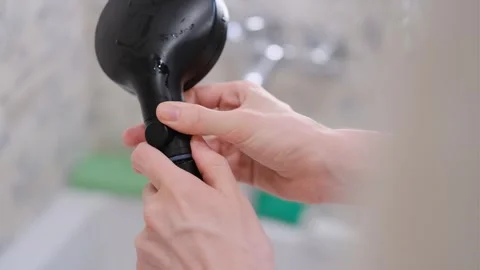 Man installing fresh clean filter on shower head, close up Stock Footage 296018801