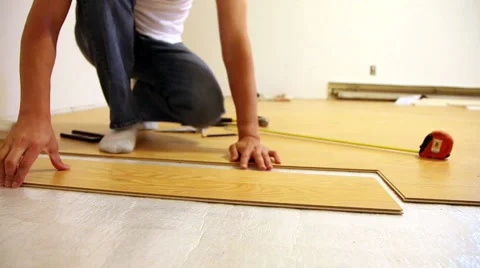 Man Installing Laminate Flooring Video stock 922392