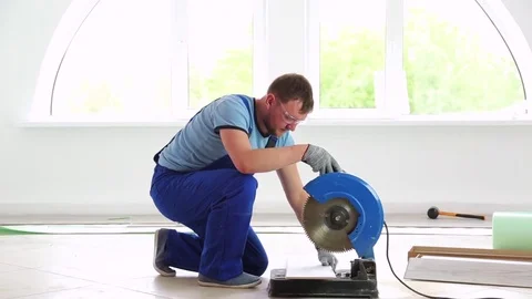 Man Installing Laminate Flooring Stock Footage 76517275