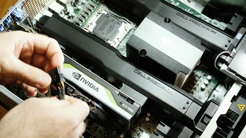 Man installing latest Nvidia Quadro RTX 5000 GPU in workstation Stock Footage 103339232