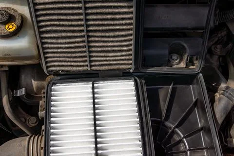 Man Installing New Engine Air Filter to Improve Car Performance Stock Photos