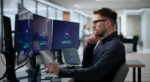 Man Installing New Software Update To Improve Slow PC Loading Speed. Stock Photos