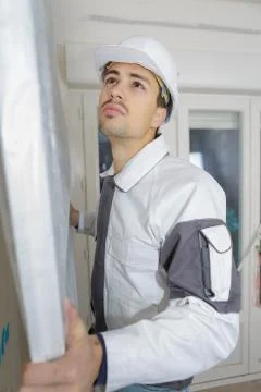 Man installing the new window Stock Photos