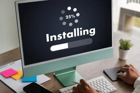 Man installing Software Update On Mobile Phone And Laptop digital technolog.. 스톡 사진