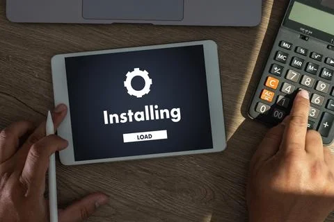 Man installing Software Update On Mobile Phone And Laptop digital technolog.. 写真素材
